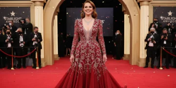 Celebrity in stunning red carpet fashion gown
