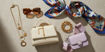 Trending fashion accessories 2026 flat lay including bags jewelry and sunglasses